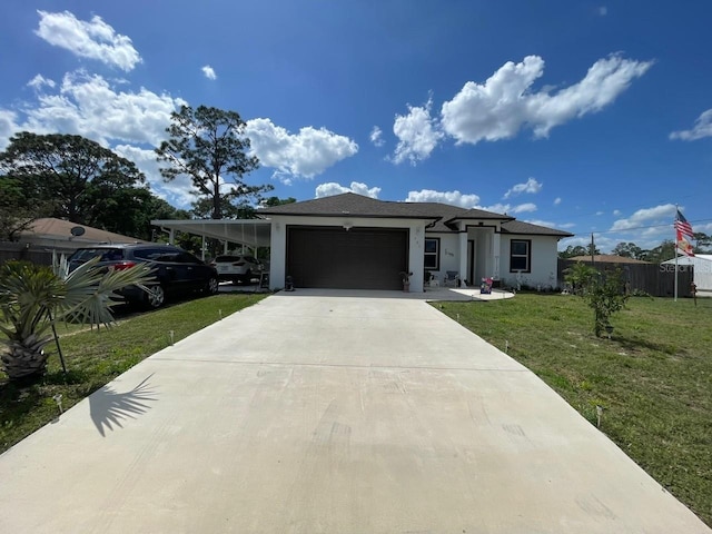 731 Triumph Dr, Sebring, FL 33872 - view of front facade with a garage, a front yard, driveway, and stucco siding