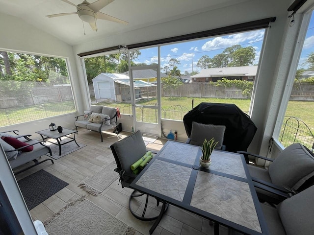731 Triumph Dr, Sebring, FL 33872 - sunroom with a ceiling fan, plenty of natural light, lofted ceiling, and outdoor lounge area