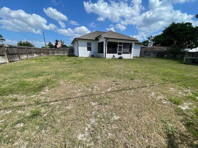 731 Triumph Dr, Sebring, FL 33872 - rear view of house featuring a sunroom, stucco siding, and roof with shingles