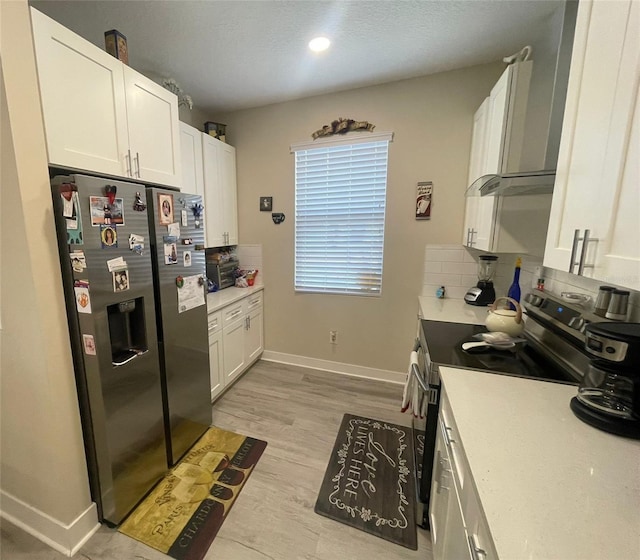 731 Triumph Dr, Sebring, FL 33872 - kitchen featuring appliances with stainless steel finishes, baseboards, white cabinets, light countertops, and recessed lighting