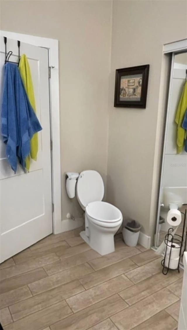 731 Triumph Dr, Sebring, FL 33872 - bathroom with toilet and wood finished floors