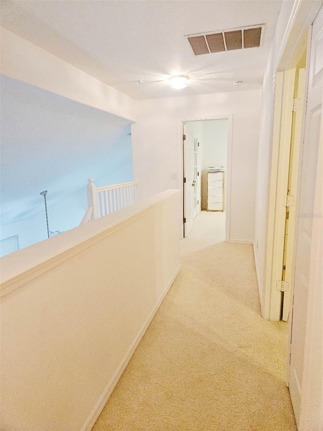 5421 Watervista Dr, Orlando, FL 32821 - hallway with carpet flooring, baseboards, and visible vents