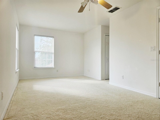 5421 Watervista Dr, Orlando, FL 32821 - unfurnished room with visible vents, a ceiling fan, baseboards, and light colored carpet