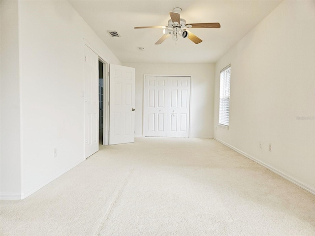 5421 Watervista Dr, Orlando, FL 32821 - unfurnished bedroom featuring baseboards, light carpet, and visible vents