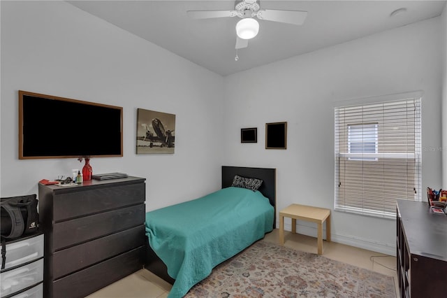 bedroom featuring light tile patterned floors and a ceiling fan