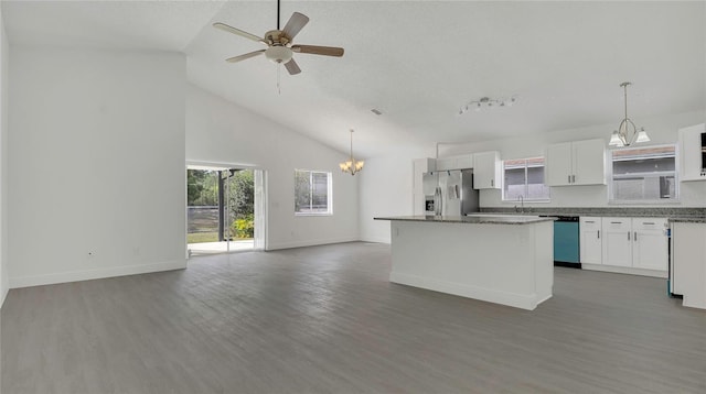 13838 Ginger Creek Blvd, Orlando, FL 32826 - kitchen with white cabinets, stainless steel fridge, dishwasher, open floor plan, and a kitchen island