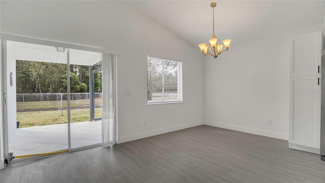 13838 Ginger Creek Blvd, Orlando, FL 32826 - interior space featuring baseboards, wood finished floors, a notable chandelier, and vaulted ceiling
