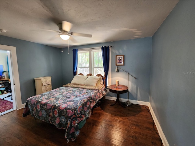 bedroom featuring hardwood / wood-style flooring, baseboards, and ceiling fan