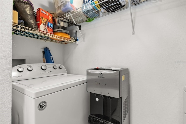 clothes washing area with laundry area and washer / dryer