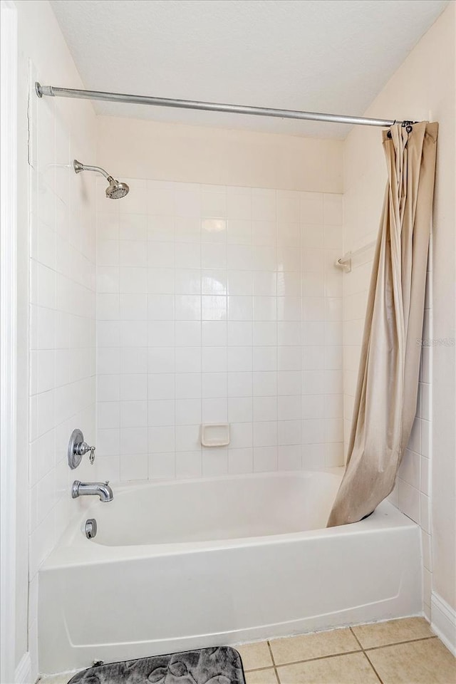 6959 Brescia Way, Orlando, FL 32819 - full bathroom with shower / tub combo with curtain and tile patterned flooring