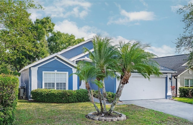view of front of property with an attached garage, driveway, stucco siding, and a front yard