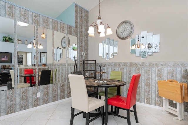 tiled dining room featuring wallpapered walls, a chandelier, and lofted ceiling