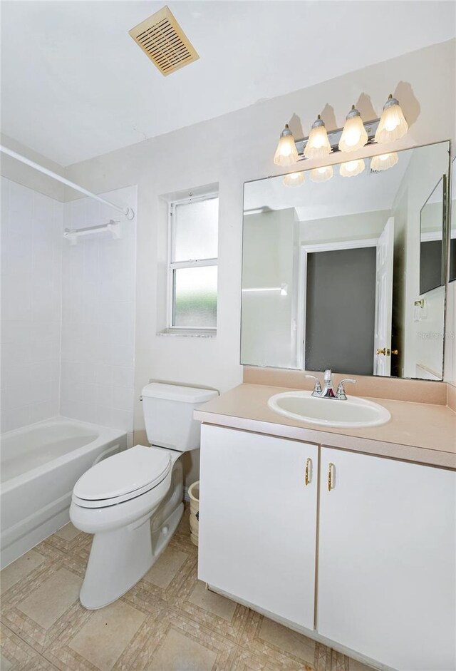 bathroom with bathtub / shower combination, vanity, visible vents, toilet, and tile patterned floors
