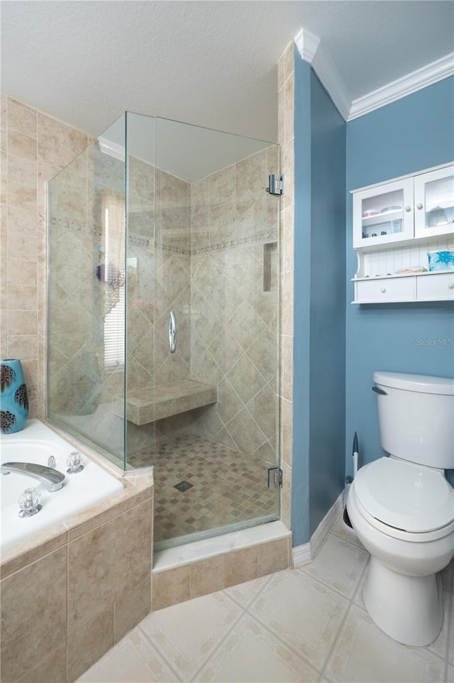 bathroom featuring toilet, crown molding, tile patterned floors, a stall shower, and a garden tub