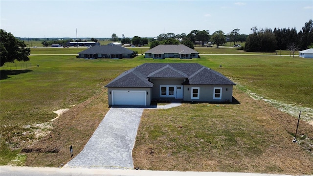 7908 Pine Glen Rd, Sebring, FL 33876 - view of front facade with decorative driveway, a garage, a front lawn, and stucco siding
