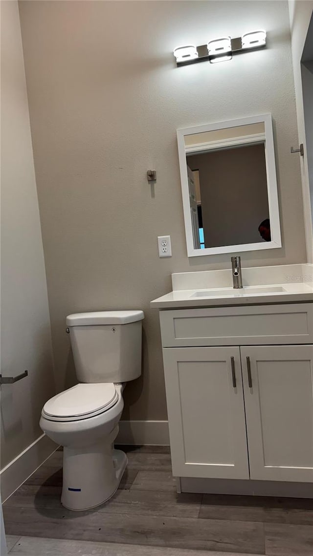 7908 Pine Glen Rd, Sebring, FL 33876 - bathroom with vanity and wood finished floors