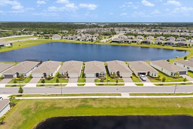 bird's eye view with a water view and a residential view