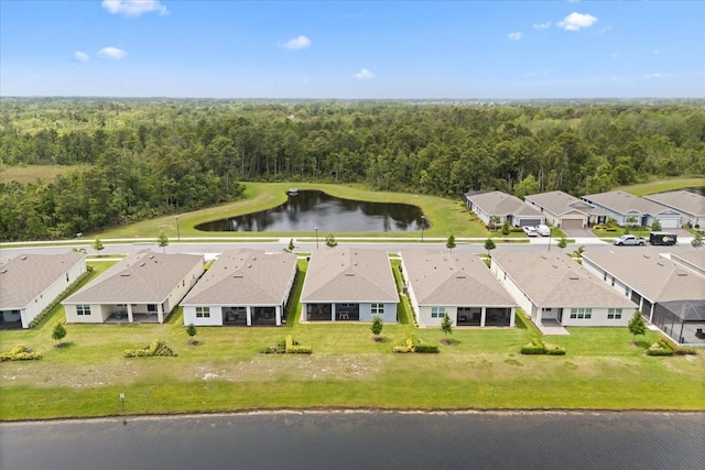 bird's eye view featuring a water view, a residential view, and a view of trees