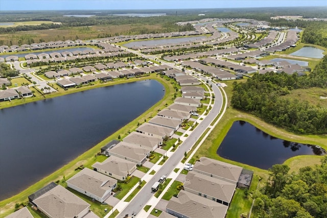 birds eye view of property featuring a water view and a residential view