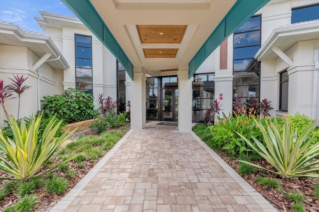 doorway to property with stucco siding