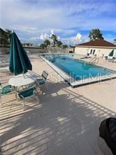 25806 Cockleshell Dr Unit 314, Bonita Springs, FL 34135 - pool with a patio area