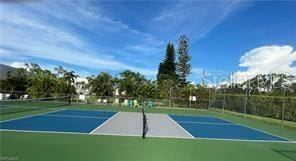 25806 Cockleshell Dr Unit 314, Bonita Springs, FL 34135 - view of tennis court featuring community basketball court and fence