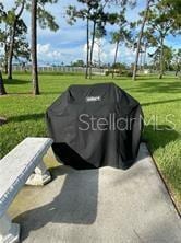 25806 Cockleshell Dr Unit 314, Bonita Springs, FL 34135 - view of property's community with a lawn