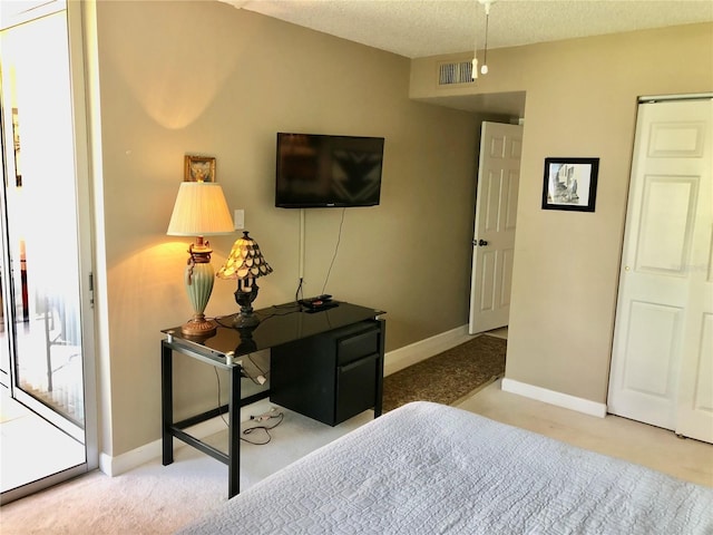 25806 Cockleshell Dr Unit 314, Bonita Springs, FL 34135 - carpeted bedroom with baseboards, access to outside, visible vents, and a textured ceiling