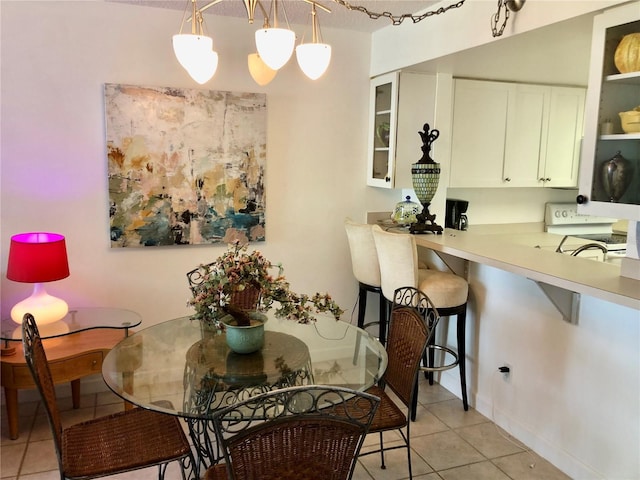 25806 Cockleshell Dr Unit 314, Bonita Springs, FL 34135 - dining area featuring baseboards and light tile patterned floors