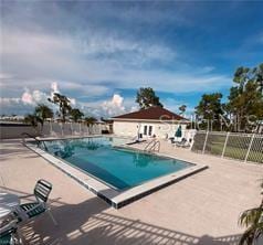 25806 Cockleshell Dr Unit 314, Bonita Springs, FL 34135 - pool with a patio area and fence