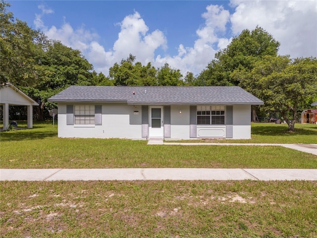 14796 SW 39th Cir, Ocala, FL 34473 - ranch-style house featuring a front lawn and roof with shingles