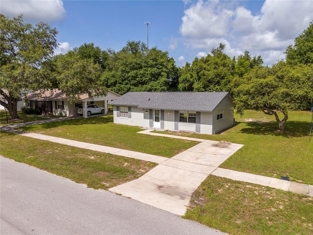 14796 SW 39th Cir, Ocala, FL 34473 - ranch-style home with a front lawn, concrete driveway, roof with shingles, and stucco siding