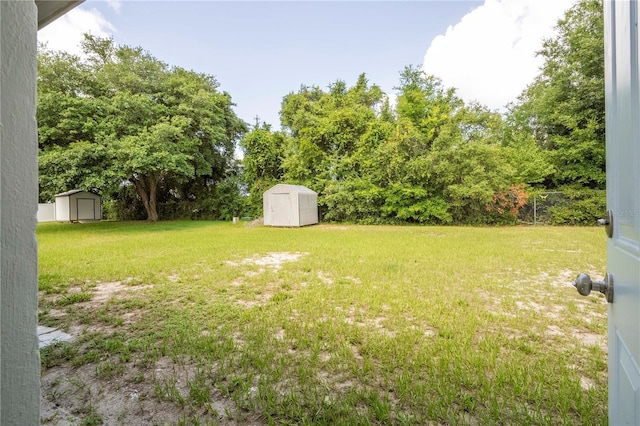 14796 SW 39th Cir, Ocala, FL 34473 - view of green lawn featuring a storage shed