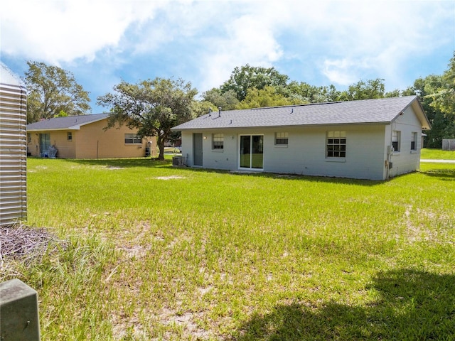 14796 SW 39th Cir, Ocala, FL 34473 - rear view of house with a lawn