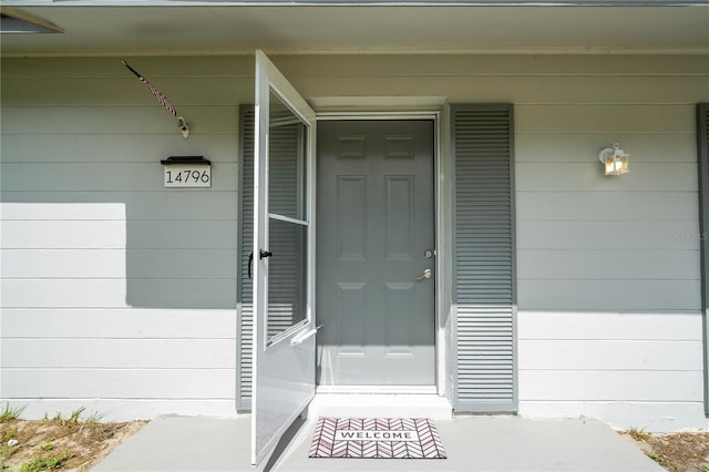 14796 SW 39th Cir, Ocala, FL 34473 - view of exterior entry featuring a porch