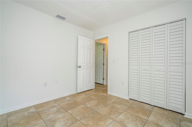 14796 SW 39th Cir, Ocala, FL 34473 - unfurnished bedroom with a closet and light tile patterned floors