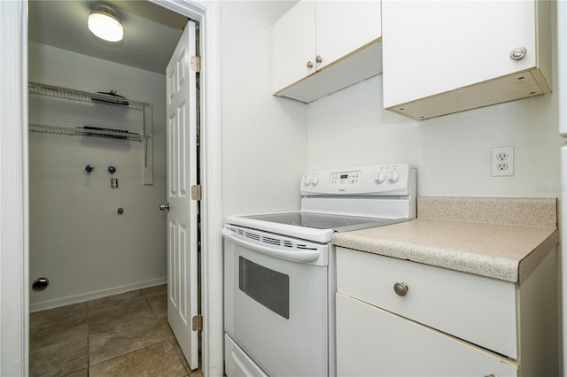 14796 SW 39th Cir, Ocala, FL 34473 - kitchen featuring white electric range, white cabinets, and light countertops