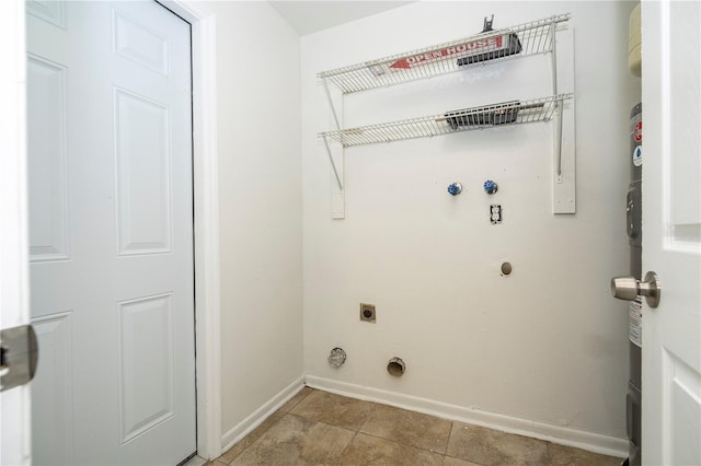 14796 SW 39th Cir, Ocala, FL 34473 - laundry room featuring electric dryer hookup and light tile patterned flooring