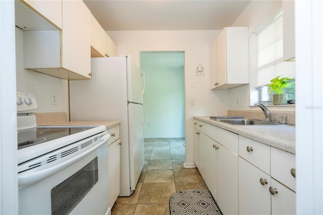 14796 SW 39th Cir, Ocala, FL 34473 - kitchen featuring electric stove, light countertops, and white cabinetry