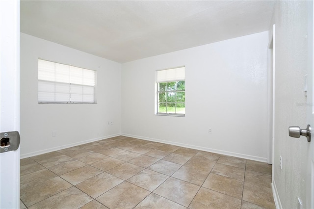 14796 SW 39th Cir, Ocala, FL 34473 - unfurnished room with light tile patterned flooring and baseboards