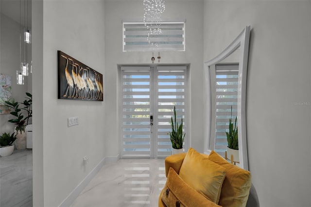 1214 Embers Pkwy W, Cape Coral, FL 33993 - doorway to outside with a notable chandelier and baseboards