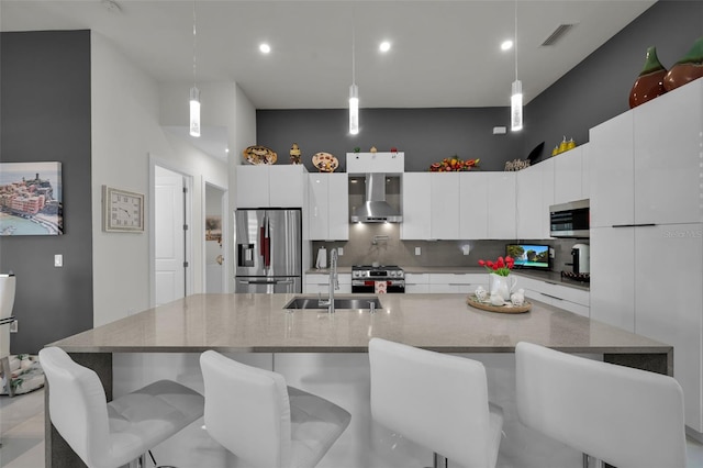 1214 Embers Pkwy W, Cape Coral, FL 33993 - kitchen featuring tasteful backsplash, wall chimney range hood, visible vents, appliances with stainless steel finishes, and a sink