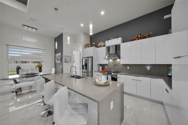1214 Embers Pkwy W, Cape Coral, FL 33993 - kitchen with white cabinets, wall chimney exhaust hood, modern cabinets, a sink, and stainless steel appliances