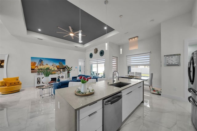 1214 Embers Pkwy W, Cape Coral, FL 33993 - kitchen featuring dishwasher, modern cabinets, a sink, a tray ceiling, and marble finish floor