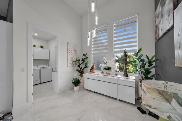1214 Embers Pkwy W, Cape Coral, FL 33993 - interior space featuring vanity, separate washer and dryer, marble finish floor, and baseboards