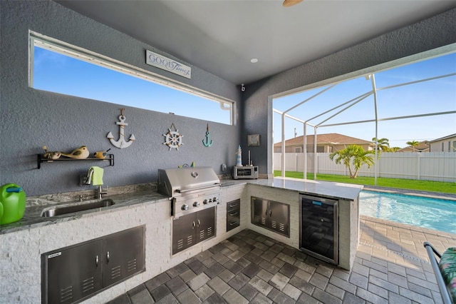 1214 Embers Pkwy W, Cape Coral, FL 33993 - view of patio / terrace featuring a lanai, fence, area for grilling, and wine cooler