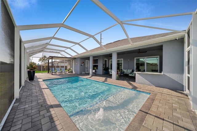 1214 Embers Pkwy W, Cape Coral, FL 33993 - outdoor pool featuring a patio area, glass enclosure, and a ceiling fan