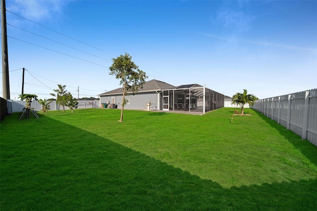 1214 Embers Pkwy W, Cape Coral, FL 33993 - view of yard with a fenced backyard and a sunroom