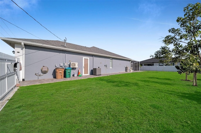 1214 Embers Pkwy W, Cape Coral, FL 33993 - back of property with a yard, fence, and stucco siding