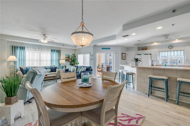 5300 S Atlantic Ave Unit 2-501, New Smyrna Beach, FL 32169 - dining space with light wood-style flooring, a textured ceiling, a ceiling fan, and recessed lighting